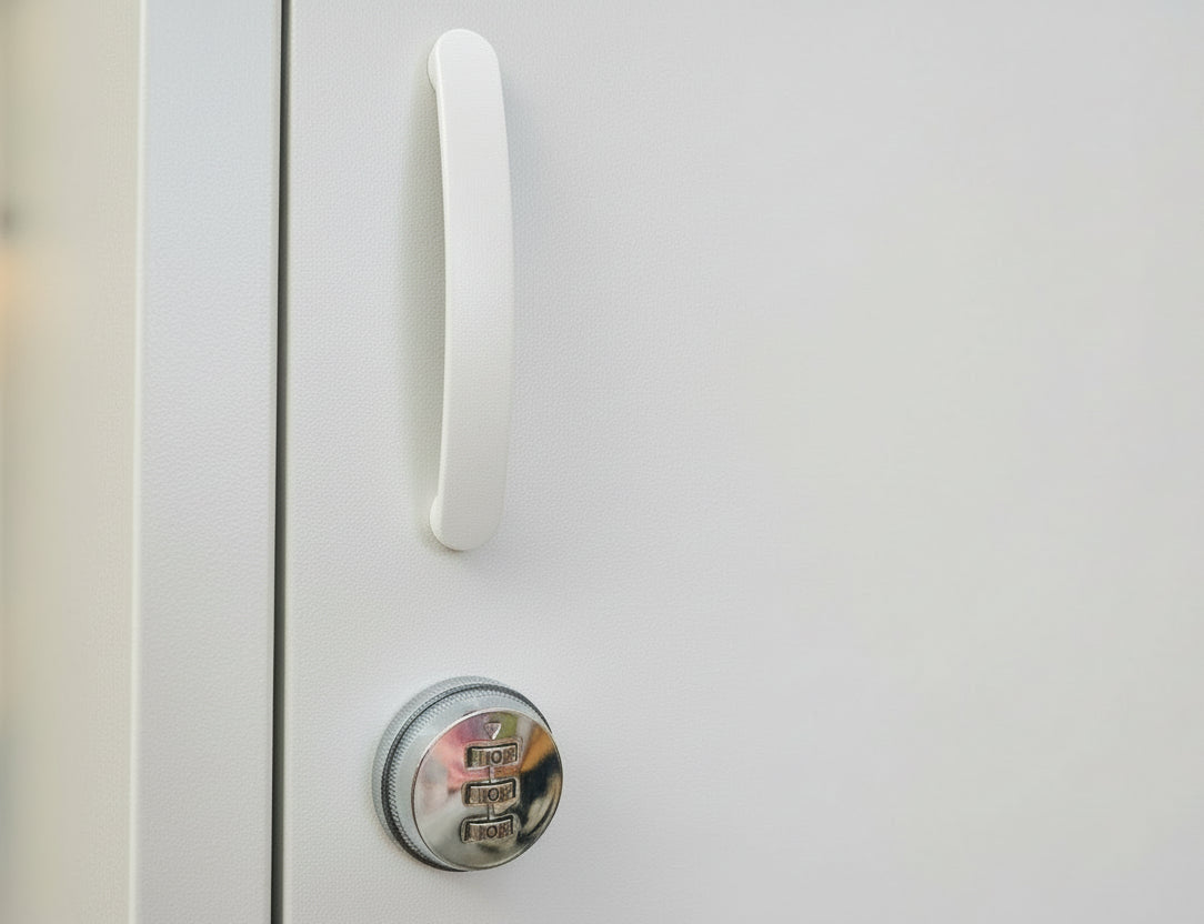 White cabinet with a silver combination lock on a light gray background