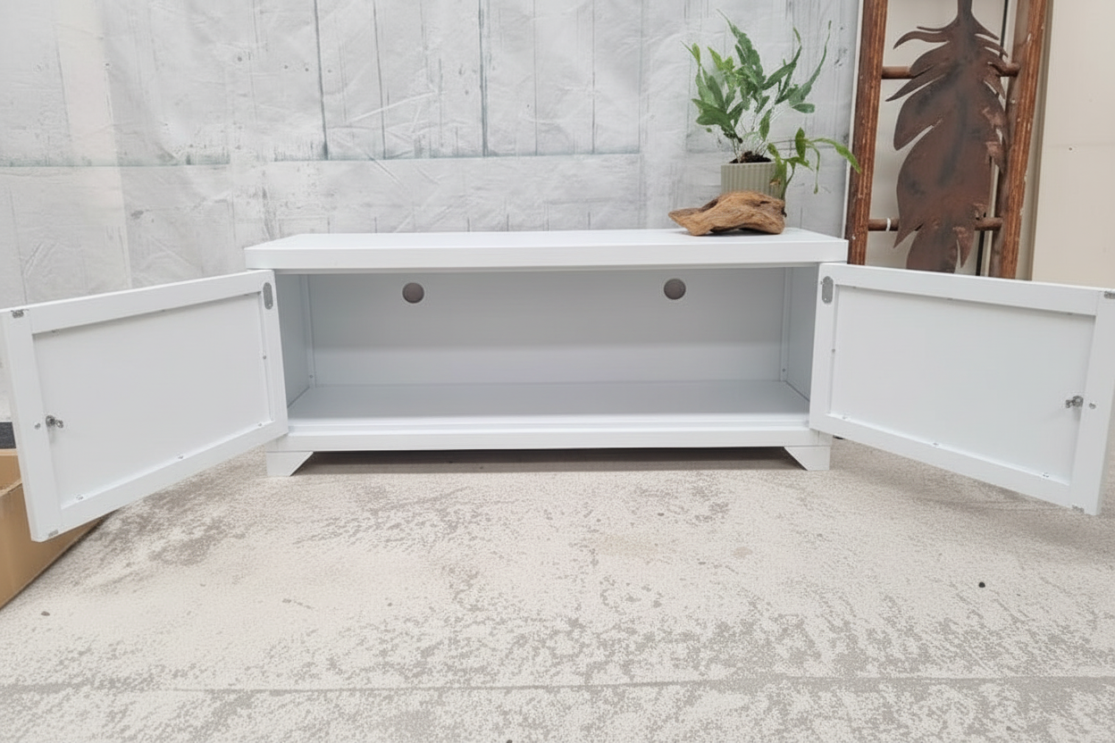 White storage cabinet with open doors on a light-colored floor.