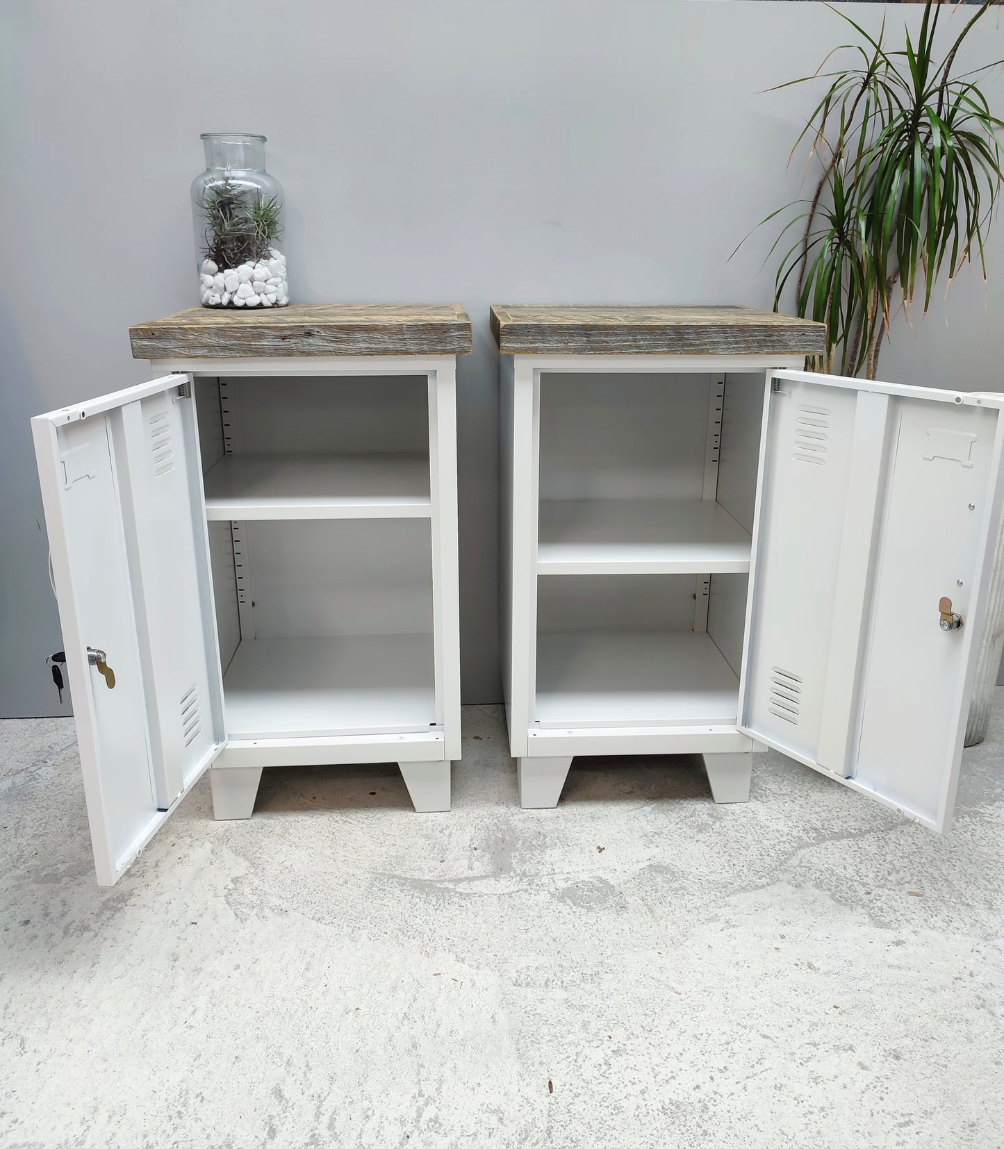 Pair of industrial White metal bedside tables with pallet tops with doors open, showing adjustable shelf.