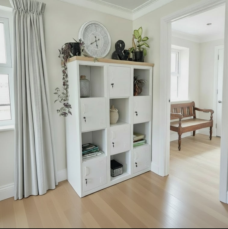 White industrial display locker cabinet with hidden storage unit with wooden top in a room with curtains and decor items.