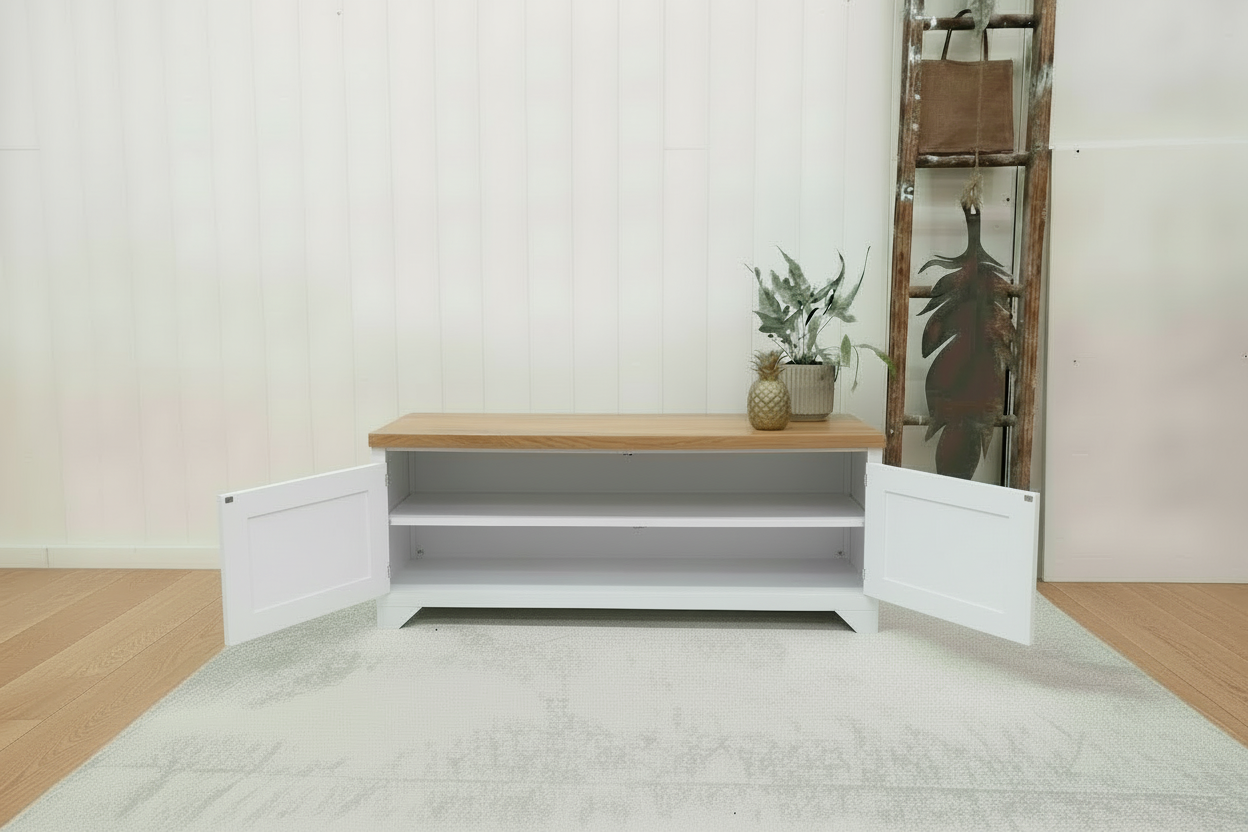 White metal TV cabinet with no shelf in storage. Oak top