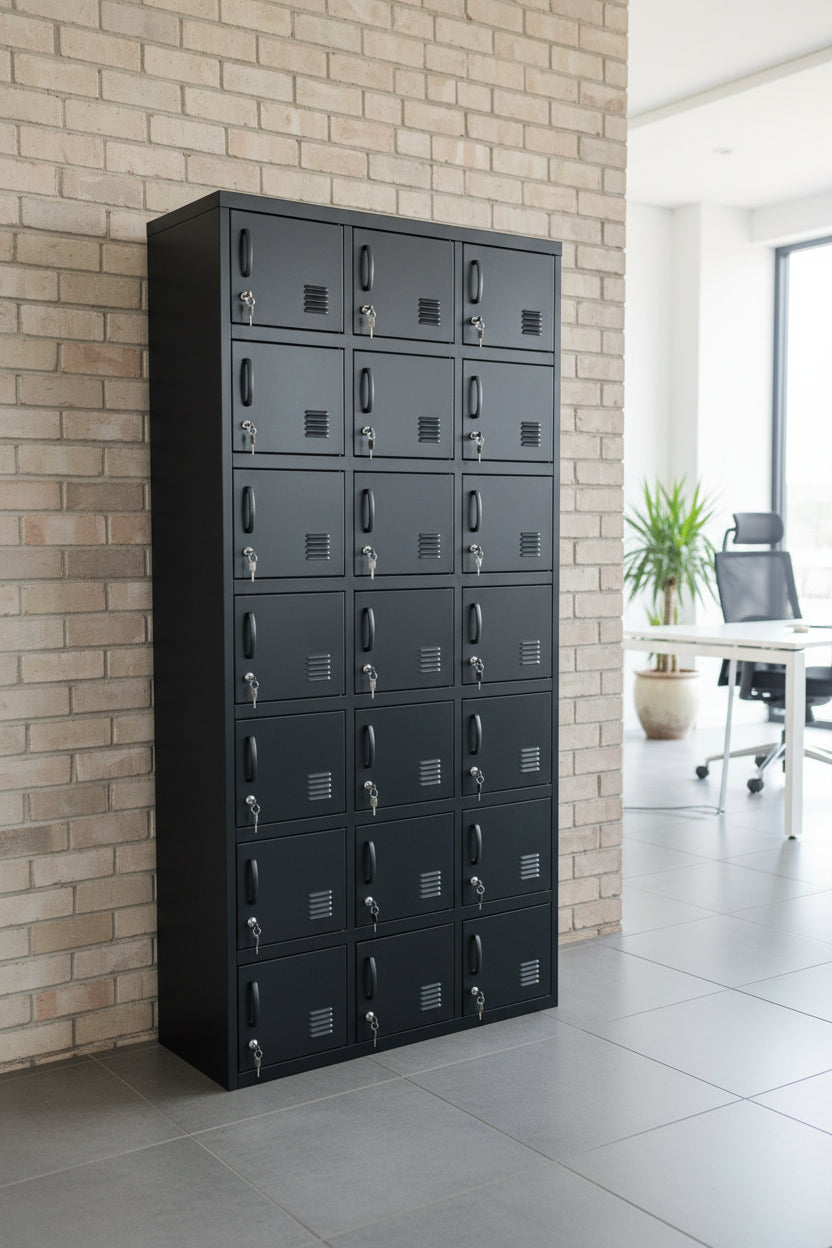 A tall black metal Door locker cabinet with 18 small lockable doors and black handles, in an office as staff lockers