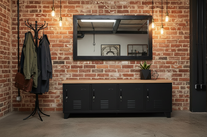 Large Black metal locker cabinet with Oak top against a brick wall with a mirror above it