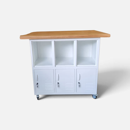 A white metal rolling storage cabinet with three open upper cubbies and three lower lockable doors, topped with a light wood countertop, shown on a plain light gray studio background.