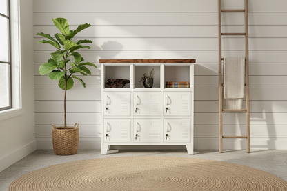A white metal 9-door locker with a dark oak top with the top as open shelves. situated against a white background with a potted plant to the side and a decorative item on top of the locker.