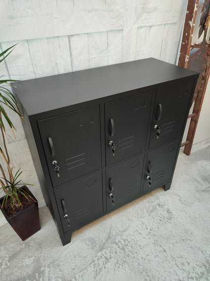 Black 6-door metal locker with each door featuring a key lock. Close up of top
