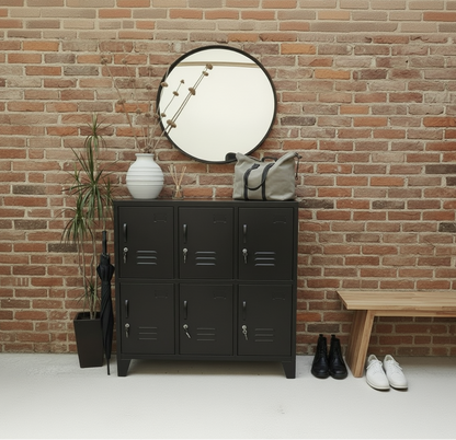 Black locker cabinet with a mirror and decorative items against a brick wall.