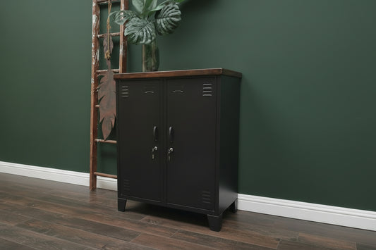 Black double side cabinet with a Dark stained recycled Rimu top against a dark green wall