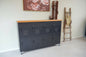 Black industrial 8 door metal locker cabinet with Rimu top and caster wheels for mobile storage