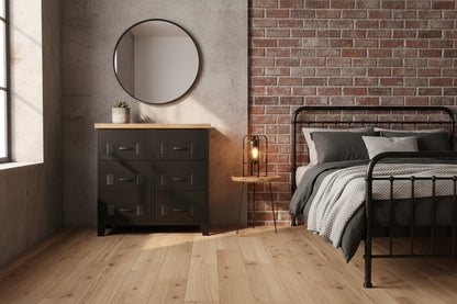 Black metal 6 drawer tallboy storage unit with decorative elements on a textured wall background
