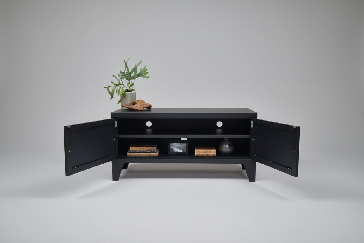 Black metal TV cabinet with door open showing cable holes and shelf