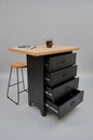 Black metal drawers with Rimu island wooden top with stools. Drawers open to show durable runners