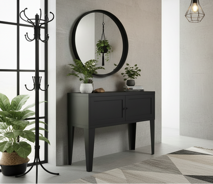Black metal industrial hall console against a gray concrete wall with a plant and decorative elements.