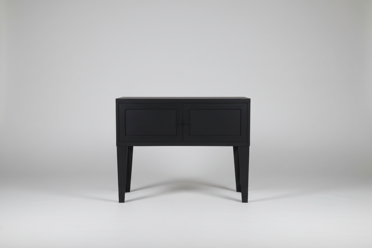 Black metal industrial side table on a white background