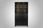 Black metal locker cabinet with open display shelving on the top half and lockable doors down the bottom