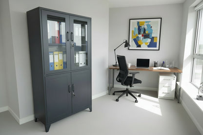 Black metal office cabinet with glass doors in an office setting