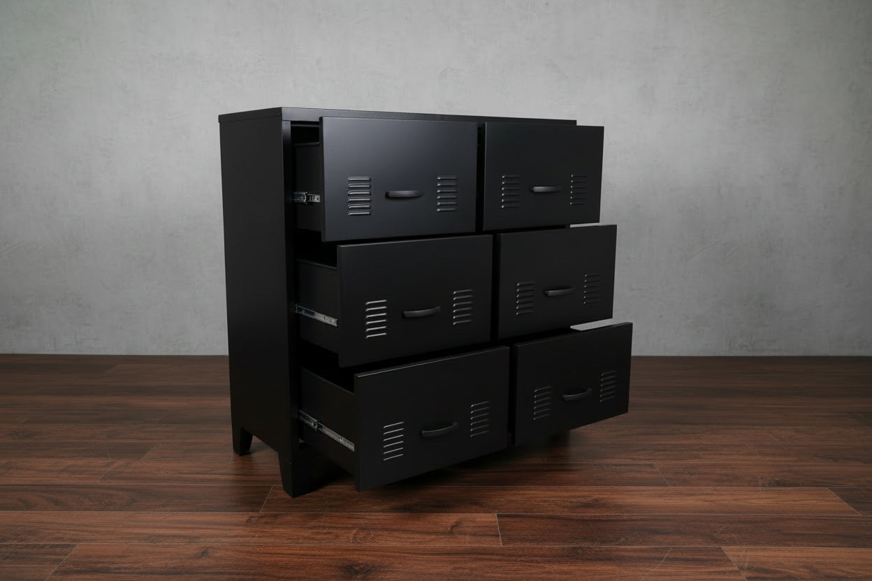 Black metal storage drawer cabinet with multiple drawers against a light gray wall.