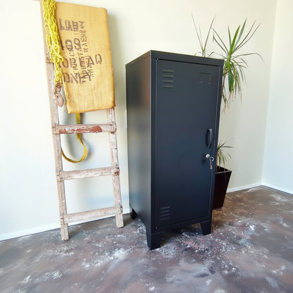 Black slim metal side cabinet with left opening door, side on view