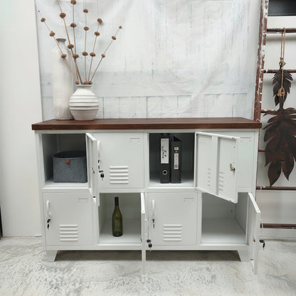 White metal storage cabinet locker with dark oak wooden top, open doors displaying books and a bottle