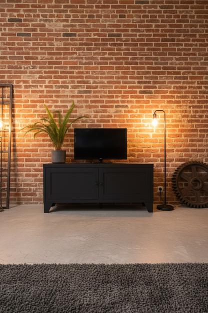 Industrial black TV cabinet with small Television on top in an industrial lounge