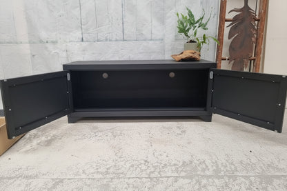 Industrial metal TV cabinet with open doors showing cable holes