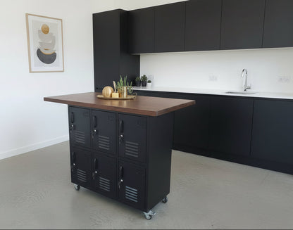 Kitchen island with black metal locker cabinets and Dark Oak wooden top in a modern kitchen.