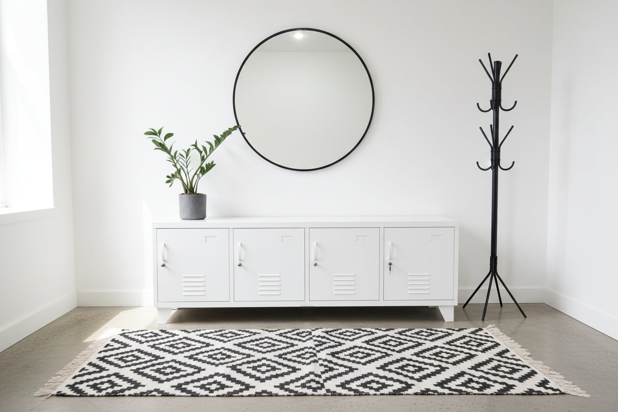 Large White Industrial Metal TV Cabinet in a White entranceway with mirror and coat rack