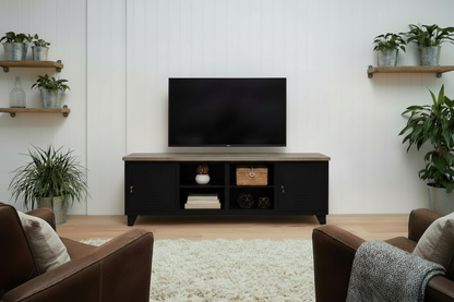 Large black industrial entertainment console with rustic grey top top with open display shelves in living room