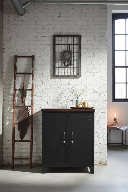 Matte Black double side cabinet with Dark stained Oak top, metal handles, and two adjustable shelves in each side, placed on a textured floor against a white background with a decorative ladder 