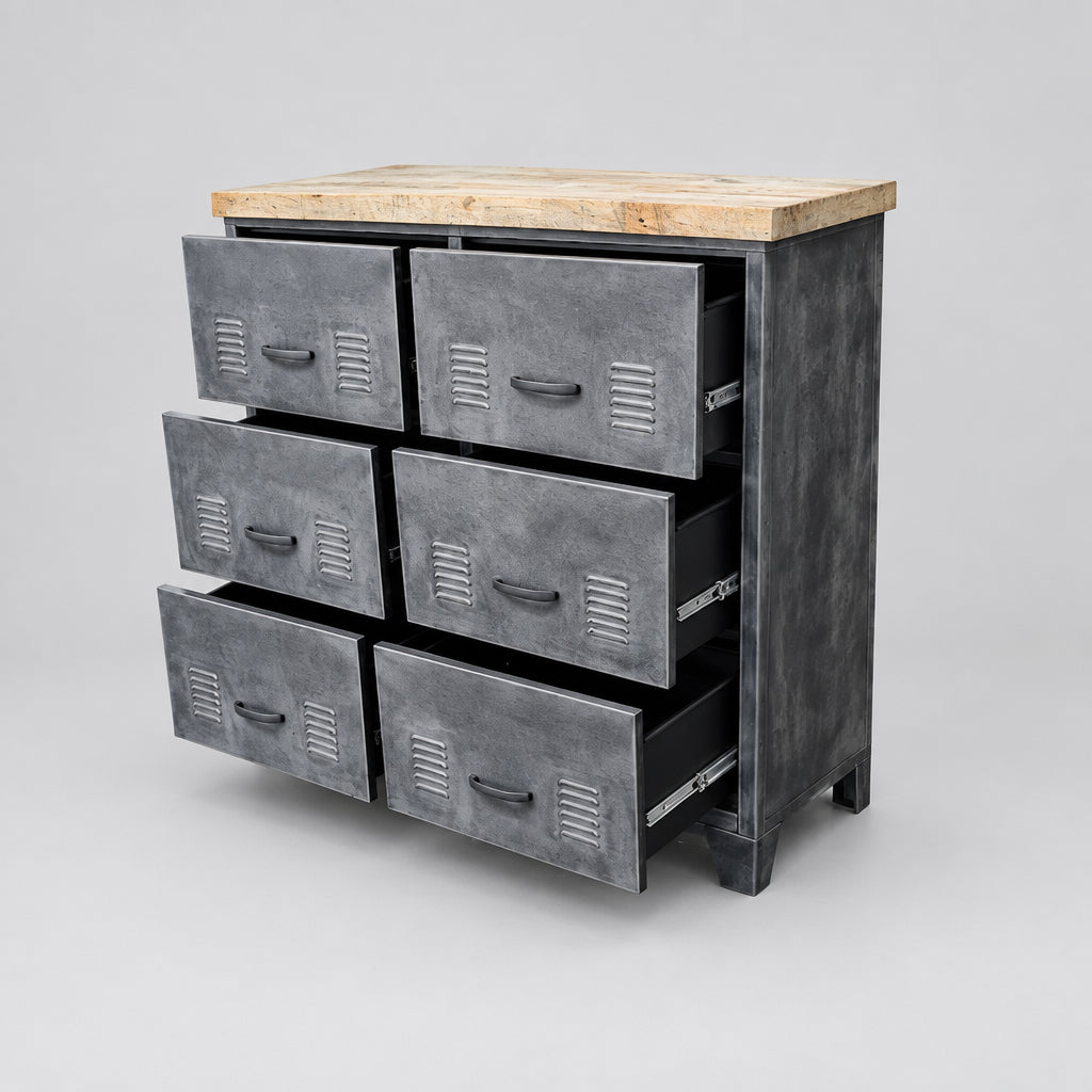 A rustic industrial-style dresser with six dark gray metal drawers and a light wood top, shown in a room setting with a brown distressed floor.