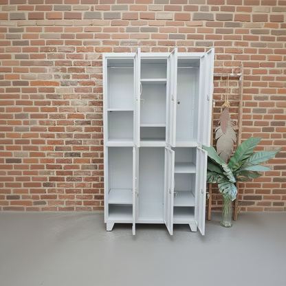 Set of tall White lockers with the 6 doors open showing hanging rods and adjustable shelves on a concrete floor.