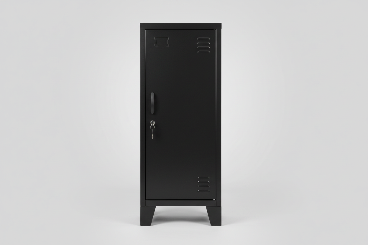 A Slim black metal side cabinet with right opening door, two adjustable shelves, placed on a floor with a potted plant and a ladder in the background.