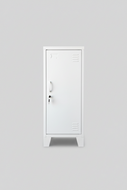 A Slim white metal side cabinet with a right hinge door, placed beside a potted plant on a concrete floor, with a wooden ladder and bags in the background.