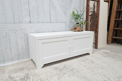 Small white Industrial metal TV cabinet with panel doors. Side angle view