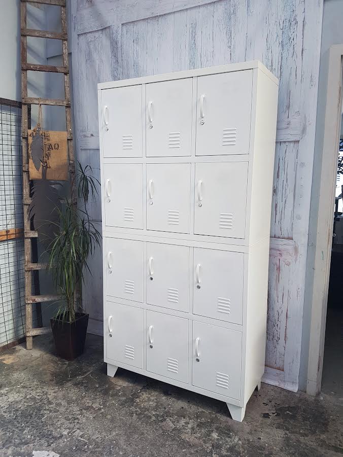 White 12 door metal locker, used as staff locker