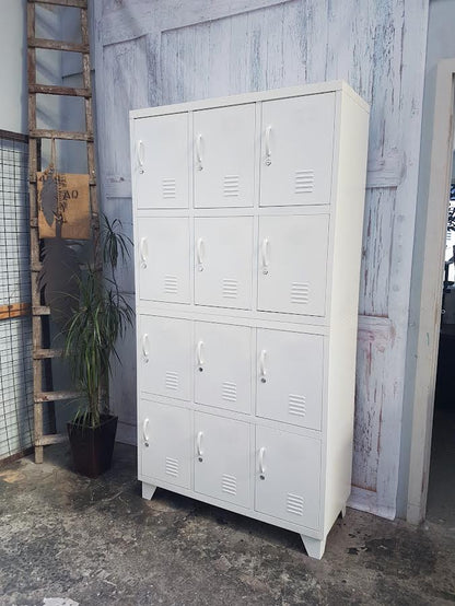 White 12 door metal locker, used as staff locker