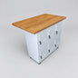 A white metal storage cabinet with six lockable doors and a rectangular Rimu top, shown on a light gray studio background.