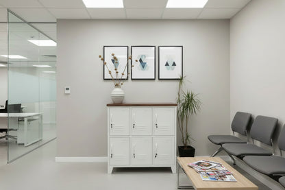 White 6 Door locker cabinet with Dark stained Recycled Rimu top used for staff lockers in waiting room