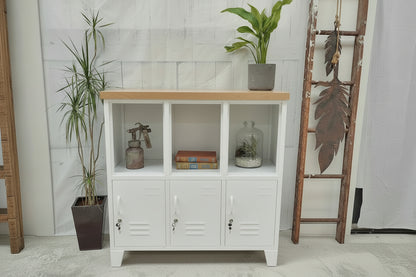 White metal cabinet with wooden Oak top in a room with plants and decorative items.