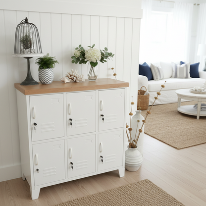 A white six-door locker with an oak top, featuring a decorative item on top and set against a neutral background.