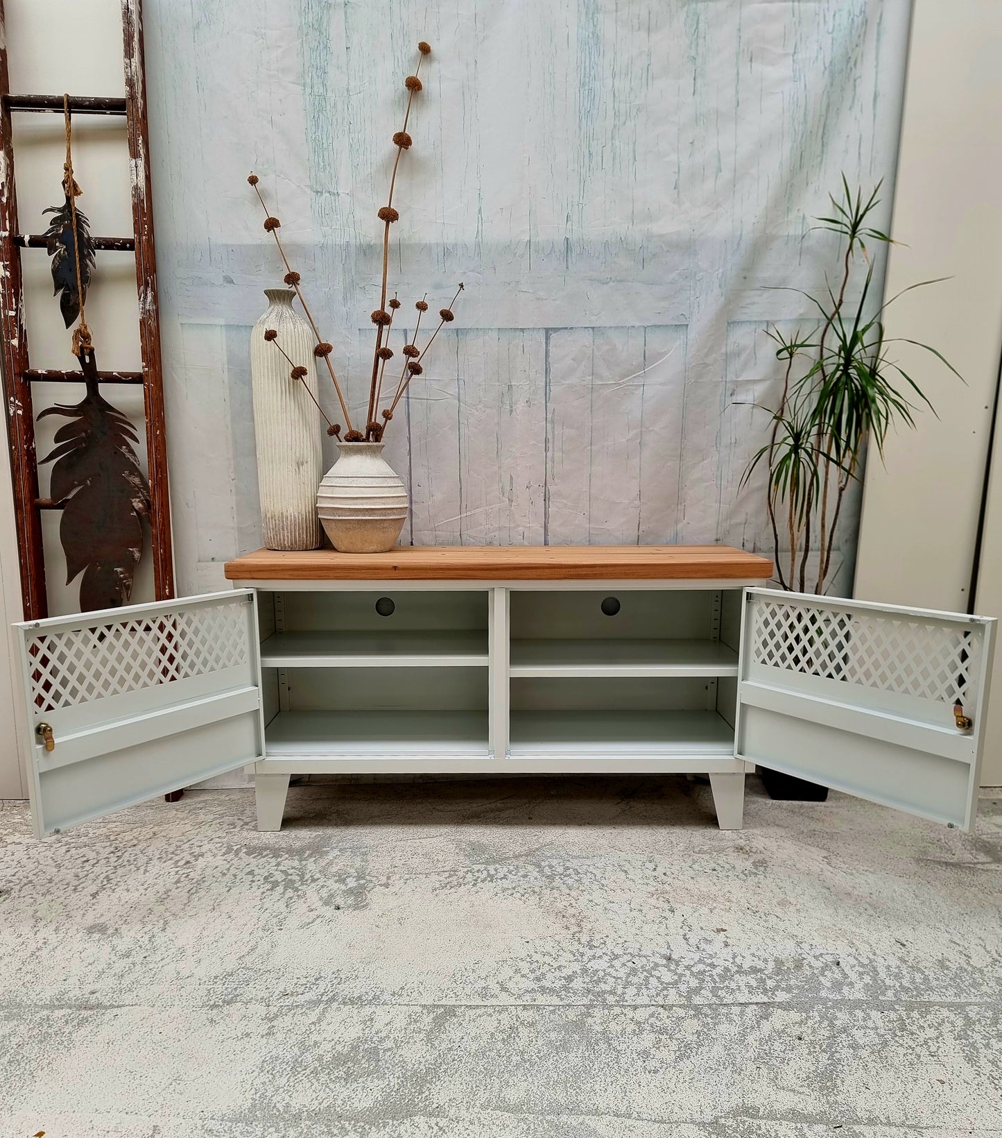 White Industrial metal TV cabinet with recycled Rimu top with doors open to show adjustable shelves and cable