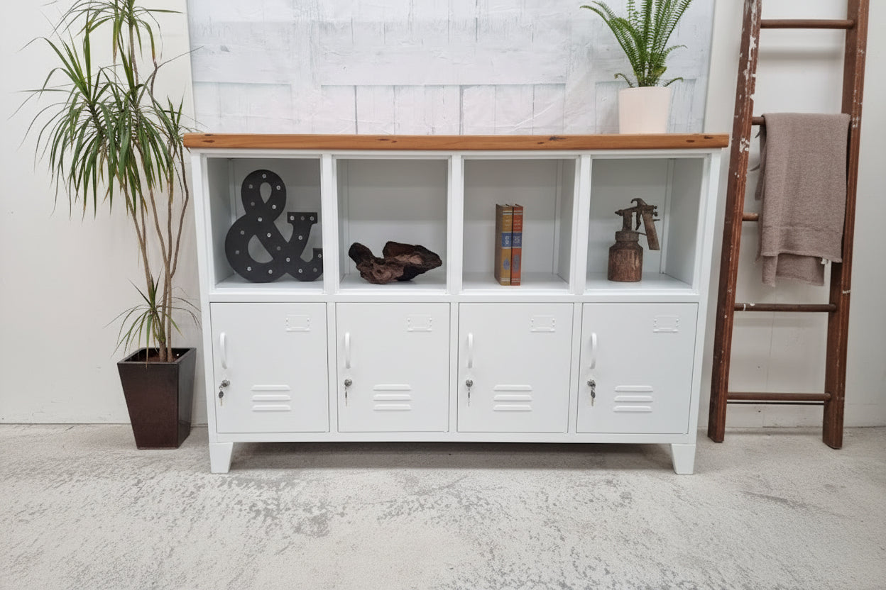 White industrial locker-style cabinet with Rimu wooden top against a white brick wall.