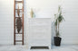 White industrial tallboy with 4 drawers in a room with plants and a ladder.