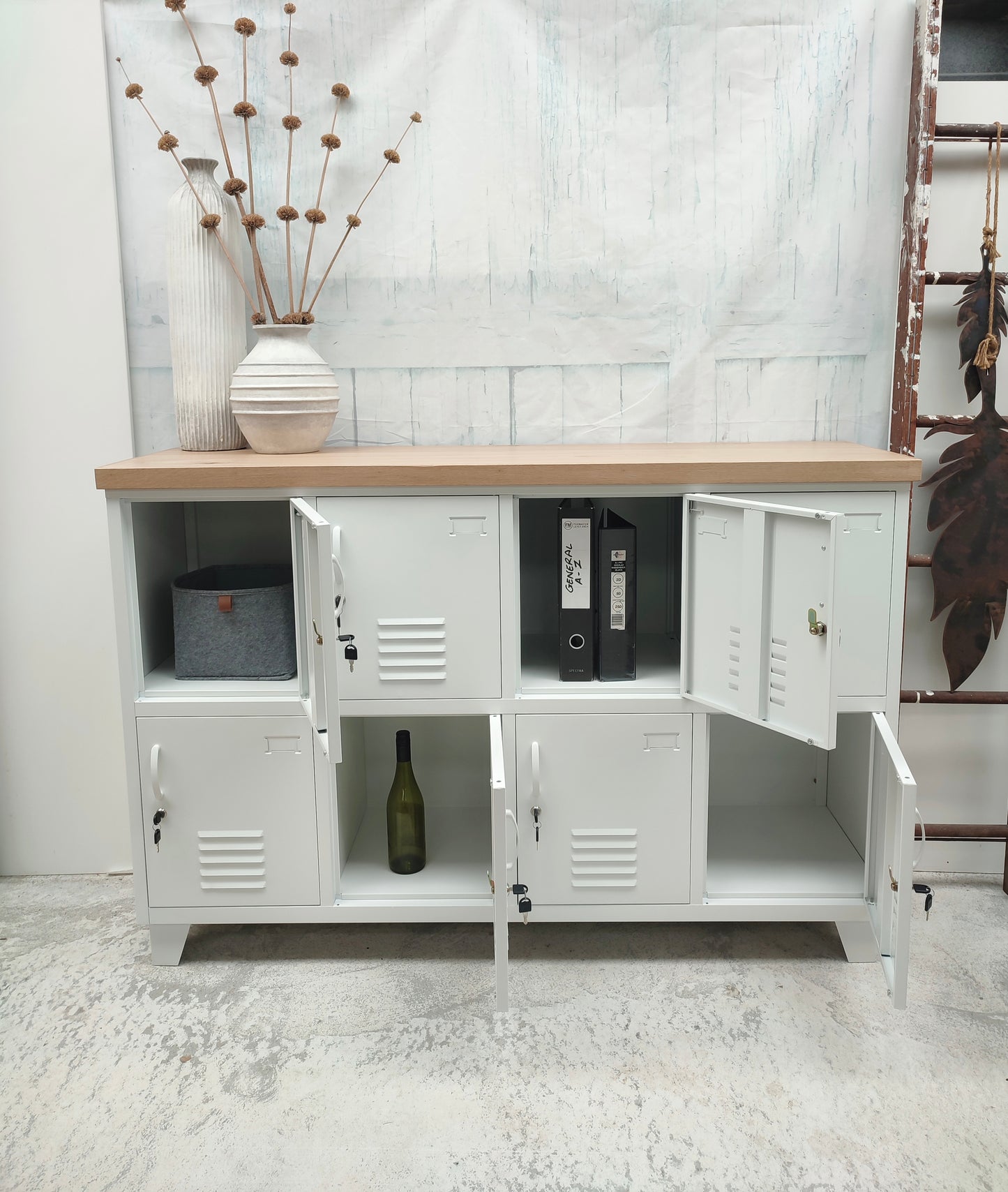 White metal 8 door locker with Oak top with doors open , showing the great lockable storage