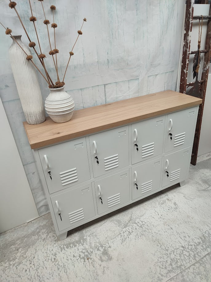 White metal 8 door locker cabinet with Oak top. Showing the great lockable storage