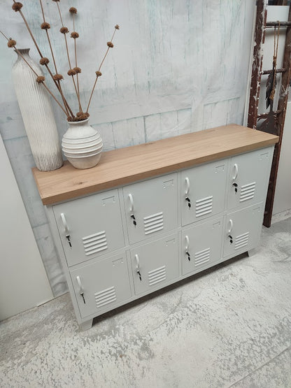 White metal 8 door locker cabinet with Oak top. Showing the great lockable storage