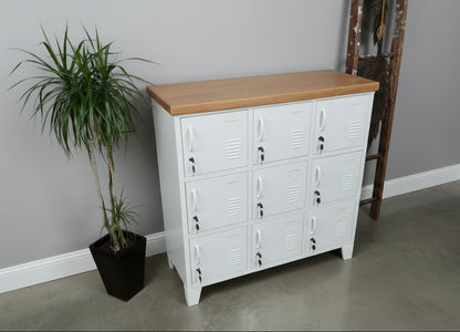 White metal 9 Door locker dresser with Rimu wooden top in a casual setting