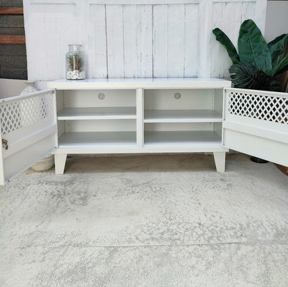 White metal TV cabinet with open doors to show adjustable shelves and cables holes