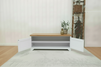White metal TV cabinet with no shelf in storage. Oak top