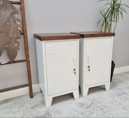 Two White metal bedside lockers with Dark Rimu tops against a light gray wall.